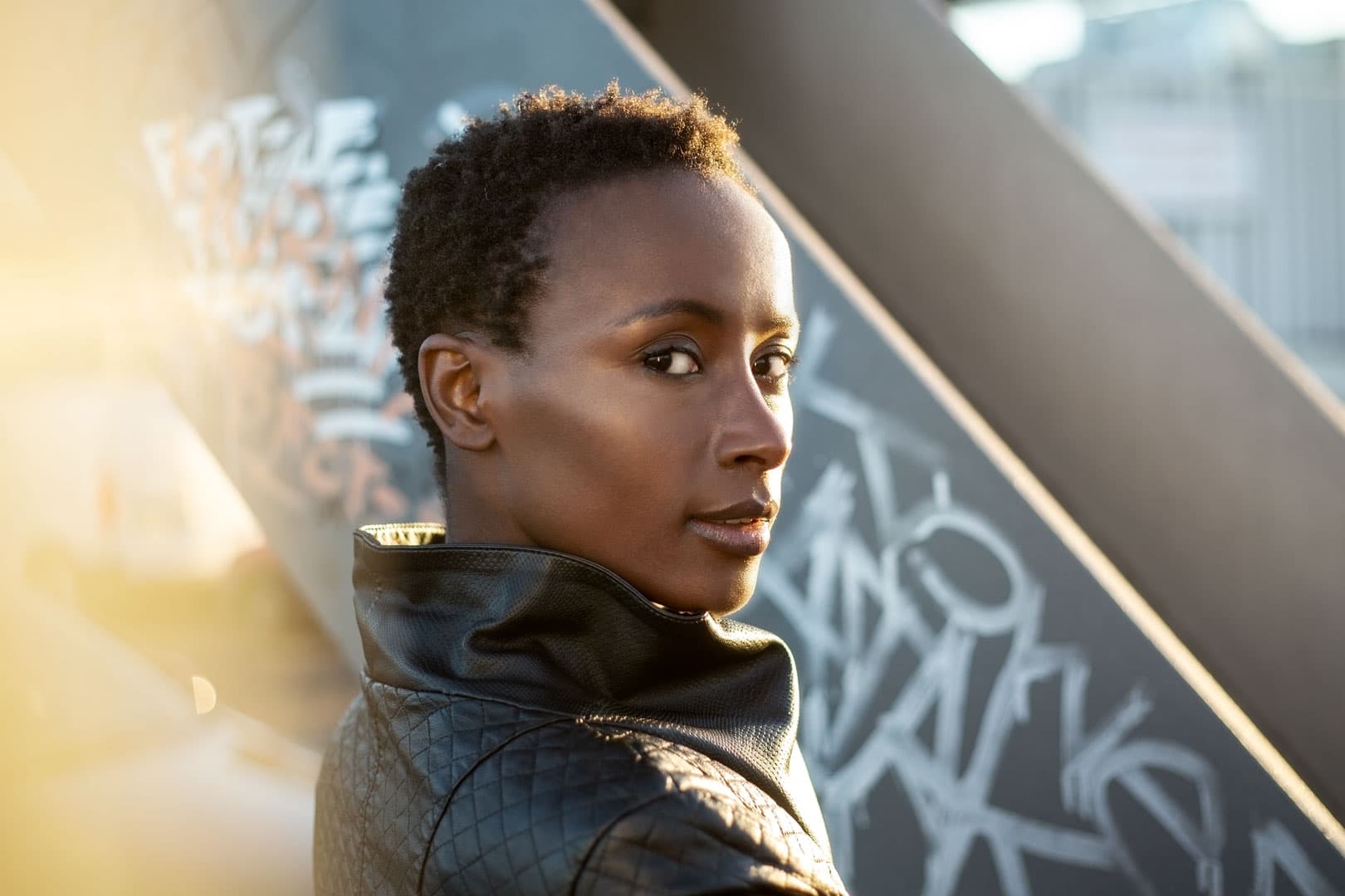 Photo of a woman in an urban setting at sun down