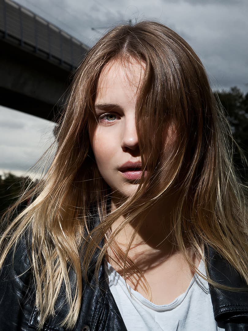 Intense portrait of a girl with wind in her hair